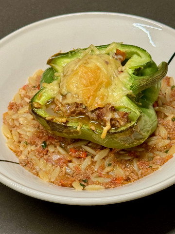 Green bell pepper with minced beef and served with orzo