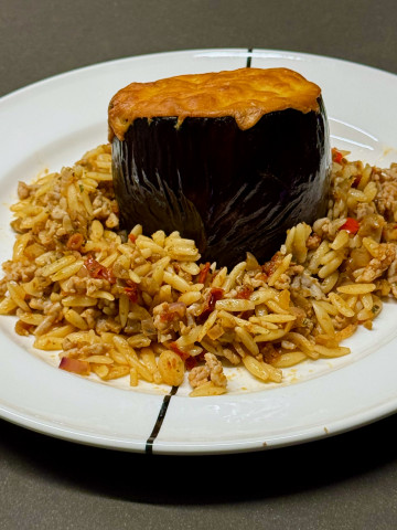 Greek style stuffed eggplant with orzo and cheddar